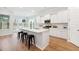 Modern kitchen with white cabinets, stainless steel appliances, a large island, and sleek black stools at 1146 Darling St, Summerville, SC 29485
