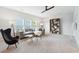 Spacious living room with neutral tones, a ceiling fan, and large windows for natural light at 1146 Darling St, Summerville, SC 29485