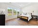 Serene main bedroom features ample natural light from a large window, complemented by modern décor at 1146 Darling St, Summerville, SC 29485