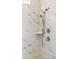 Modern shower featuring dual shower heads and elegant marble-patterned tile surround at 1146 Darling St, Summerville, SC 29485