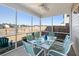 Screened patio featuring a table, six chairs, a ceiling fan, and views of the backyard and pond at 1148 Flyway Rd, Summerville, SC 29483