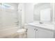 Well-lit bathroom features a shower-tub combination, single sink, and vanity with modern fixtures at 1251 Wading Point Blvd, Huger, SC 29450