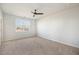 Bedroom with carpet flooring, ceiling fan, and a large window to let in plenty of natural light at 1251 Wading Point Blvd, Huger, SC 29450