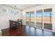 Sunlit dining area features hardwood floors, slider to patio, and modern pendant lighting fixture at 1251 Wading Point Blvd, Huger, SC 29450