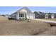 Attractive single-story home with a well-maintained lawn, attached garage, and quaint landscaping at 1251 Wading Point Blvd, Huger, SC 29450