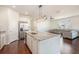 Open kitchen features a large center island, stainless steel appliances, and connects to the living room at 1251 Wading Point Blvd, Huger, SC 29450