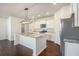 Bright kitchen with granite countertops, stainless steel appliances, and an island with pendant lighting at 1251 Wading Point Blvd, Huger, SC 29450