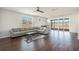 Open living room with hardwood floors, lots of light, and a large sofa with backyard views at 1251 Wading Point Blvd, Huger, SC 29450