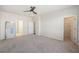 Spacious main bedroom featuring a ceiling fan, carpeted floor, and bright neutral paint at 1251 Wading Point Blvd, Huger, SC 29450
