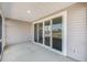 Screened-in porch with sliding glass doors leading to the backyard, offering seamless indoor-outdoor living at 1251 Wading Point Blvd, Huger, SC 29450