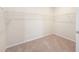 This walk-in closet features carpet flooring and shelving for storage at 1251 Wading Point Blvd, Huger, SC 29450