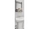 Bathroom featuring a pedestal sink, modern faucet, and a decorative mirror with shelf at 127 Rosefield Ct, Summerville, SC 29485