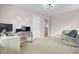 Bedroom featuring carpet, pink walls, and a desk, offering access to a bathroom at 127 Rosefield Ct, Summerville, SC 29485