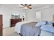 Comfortable bedroom with ceiling fan, dresser, and television, connected to kitchen and bath at 127 Rosefield Ct, Summerville, SC 29485