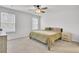 Bright bedroom featuring carpet, a ceiling fan, two windows, and neutral walls at 127 Rosefield Ct, Summerville, SC 29485