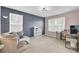 Spacious bedroom featuring carpet, a desk, an accent wall, and large windows at 127 Rosefield Ct, Summerville, SC 29485