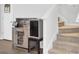 Entryway featuring a wooden wine rack with a wine cooler and access to carpeted stairs at 127 Rosefield Ct, Summerville, SC 29485