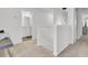 Hallway with neutral carpet, featuring an entrance to a bathroom and additional rooms at 127 Rosefield Ct, Summerville, SC 29485