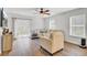 Bright living room featuring a ceiling fan, sliding glass doors to patio, and comfortable seating at 127 Rosefield Ct, Summerville, SC 29485