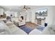 Comfortable seating, a modern television, a dining table and an open concept kitchen provide space to live at 127 Rosefield Ct, Summerville, SC 29485