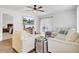 Cozy living room featuring modern TV, comfortable seating, and sliding glass doors to backyard at 127 Rosefield Ct, Summerville, SC 29485