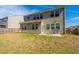 Large backyard with a patio area and well-maintained lawn, enclosed by a wood fence at 1273 Discovery Dr, Ladson, SC 29456