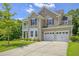 Beautiful two-story home featuring a two-car garage, well-maintained lawn and attractive curb appeal at 1273 Discovery Dr, Ladson, SC 29456