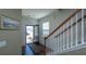 Inviting foyer featuring hardwood floors, staircase, and an open doorway to the outside at 1273 Discovery Dr, Ladson, SC 29456