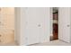 Hallway view with closet and entry to bathroom on left and opening to kitchen on right at 1273 Discovery Dr, Ladson, SC 29456