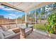 Relaxing screened porch with wicker furniture, perfect for enjoying the outdoors at 130 Wappoo Trace Ln, Summerville, SC 29486