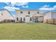 Expansive backyard features a large lawn, patio with seating, and screened-in porch for outdoor living at 130 Wappoo Trace Ln, Summerville, SC 29486