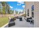 Spacious backyard with patio, perfect for outdoor entertaining with ample seating and wooded views at 130 Wappoo Trace Ln, Summerville, SC 29486