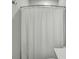 Neutral bathroom with tile walls, a white shower curtain, and a white countertop at 130 Wappoo Trace Ln, Summerville, SC 29486