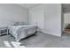 Cozy bedroom featuring neutral decor, plush carpeting, and a convenient closet for optimal storage at 130 Wappoo Trace Ln, Summerville, SC 29486