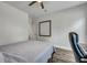 Modern bedroom with a gray bedspread, ceiling fan and desk, creating a serene and stylish living space at 130 Wappoo Trace Ln, Summerville, SC 29486
