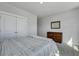 Bedroom features a plush bed, dresser, mirror, and white trim at 130 Wappoo Trace Ln, Summerville, SC 29486