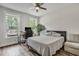 Inviting bedroom with natural light, cozy bed, and a functional workspace for added convenience at 130 Wappoo Trace Ln, Summerville, SC 29486