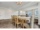 Cozy dining room features a wooden table, seating for eight, and decorative lighting at 130 Wappoo Trace Ln, Summerville, SC 29486