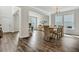 Spacious dining area with table and chairs, chandelier, and wood flooring at 130 Wappoo Trace Ln, Summerville, SC 29486