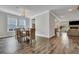 Open-concept home features a dining room, hardwood floors, and natural light at 130 Wappoo Trace Ln, Summerville, SC 29486