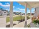 Cozy front porch with rocking chair seating and picturesque neighborhood views at 130 Wappoo Trace Ln, Summerville, SC 29486