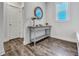 Entry way hallway featuring wood floors, natural light, and a decorative console table at 130 Wappoo Trace Ln, Summerville, SC 29486