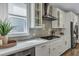 Sleek kitchen featuring stainless steel appliances, light countertops, and subway tile backsplash at 130 Wappoo Trace Ln, Summerville, SC 29486