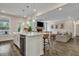 Open-concept kitchen with a large island, stainless steel appliances, and seamless flow into the living room at 130 Wappoo Trace Ln, Summerville, SC 29486