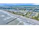 Picturesque aerial view of condos close to the beach, pier, and recreational amenities, perfect for coastal living at 1300 Ocean Blvd # 114 A, Isle of Palms, SC 29451