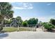 Scenic beach access point surrounded by palm trees and lush greenery, providing a tranquil path to the sandy shore at 1300 Ocean Blvd # 114 A, Isle of Palms, SC 29451