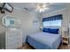 Charming bedroom with a full bed, white wicker dresser, and a flat screen TV at 1300 Ocean Blvd # 114 A, Isle of Palms, SC 29451
