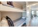 Cozy bunk beds with blue bedding and pillows, nestled within a hallway leading to living spaces at 1300 Ocean Blvd # 114 A, Isle of Palms, SC 29451