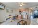 Open-concept kitchen with wooden cabinets, backsplash and an adjacent dining area with seating at 1300 Ocean Blvd # 114 A, Isle of Palms, SC 29451