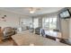 Bright living room with comfortable seating and balcony access, connected to the kitchen area at 1300 Ocean Blvd # 114 A, Isle of Palms, SC 29451